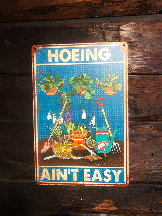 Plåtskylt - Hoeing ain't easy